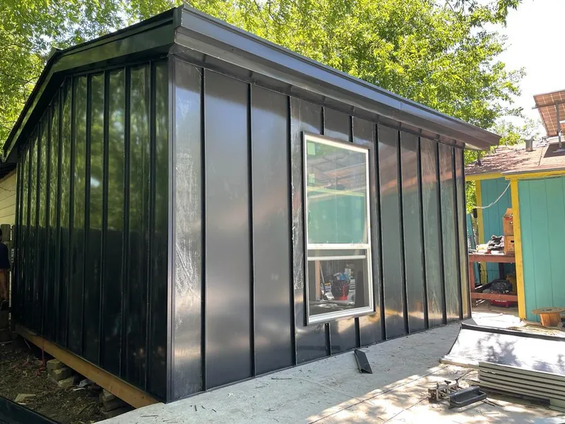 Black standing seam metal wall panels for Roof Inspection in Royse City