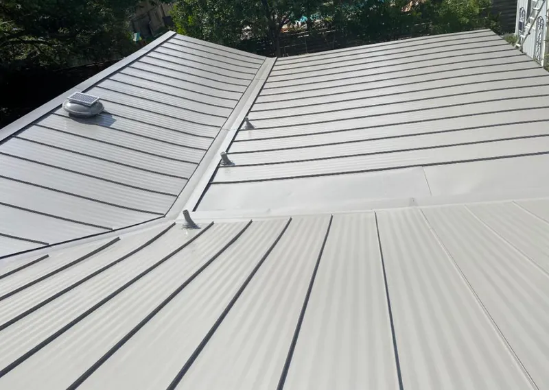 Solar attic fan installed on a metal roof for Roof Ventilation in Royse City